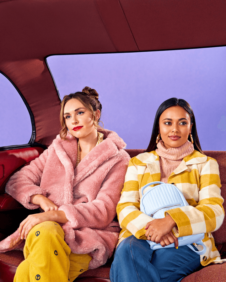 colorful 80s themed image of two women