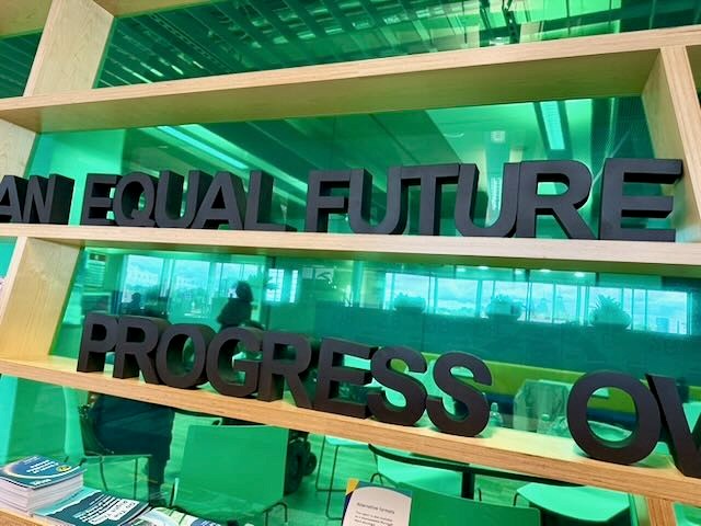 Image of letters on a stack of shelves that say 'an equal future, progress on'