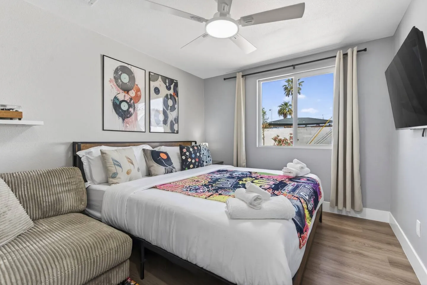 King bedroom with a lounge chair, Retro Vegas in North Las Vegas