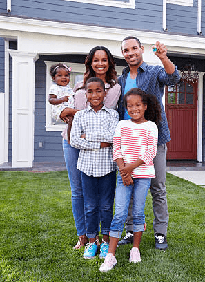 A family in front of their house