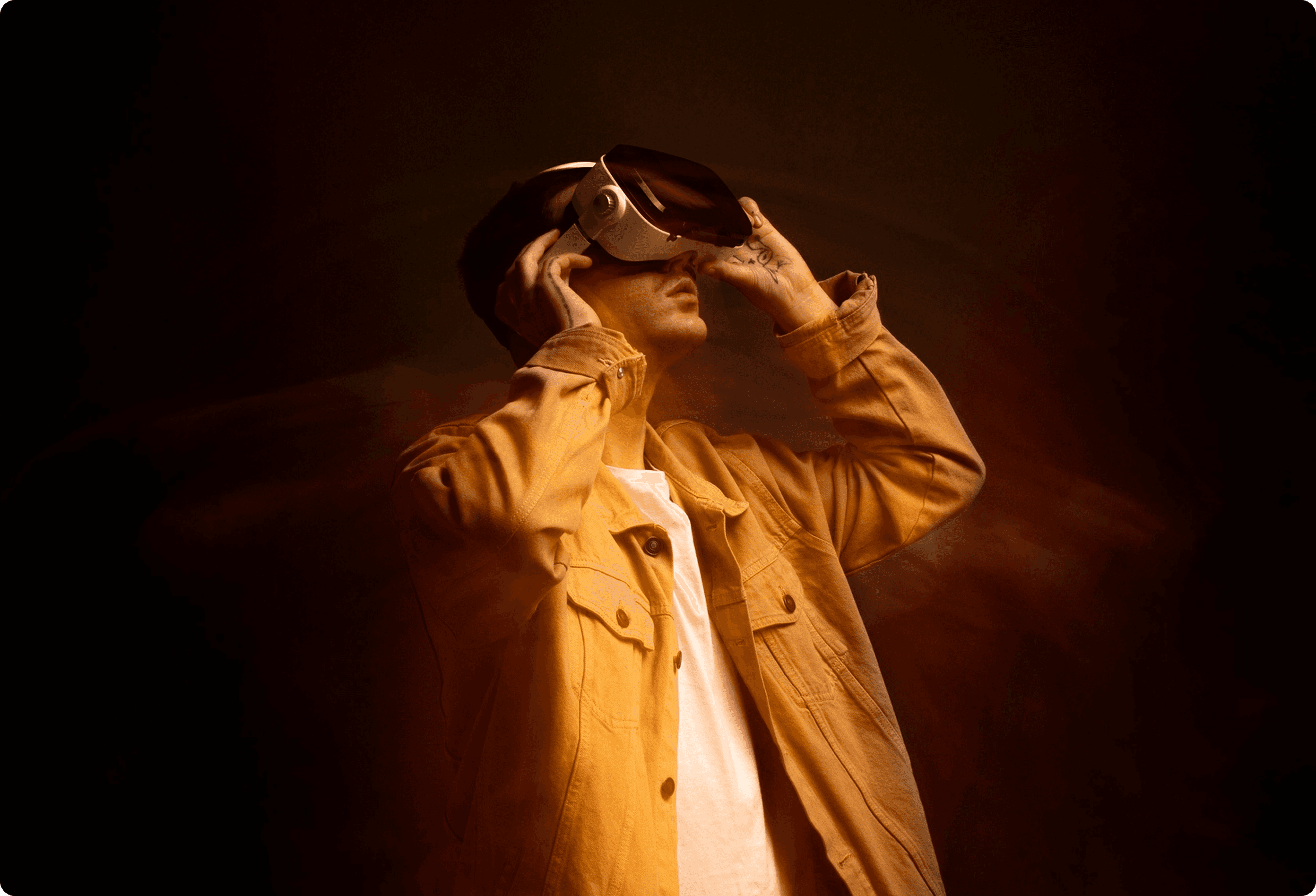 Colorful gaming and streaming desk setup with monitor, keyboard, and microphone.