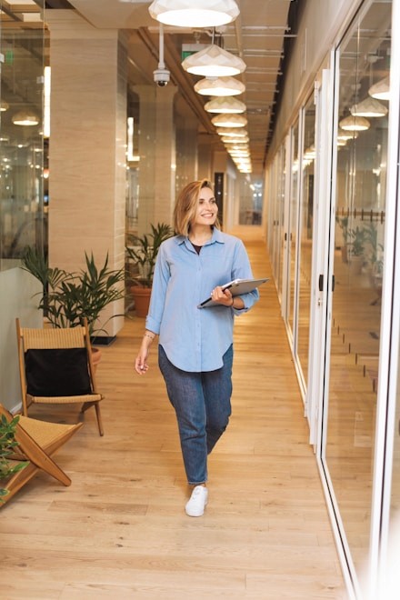 Fractional executive walking down a hall.