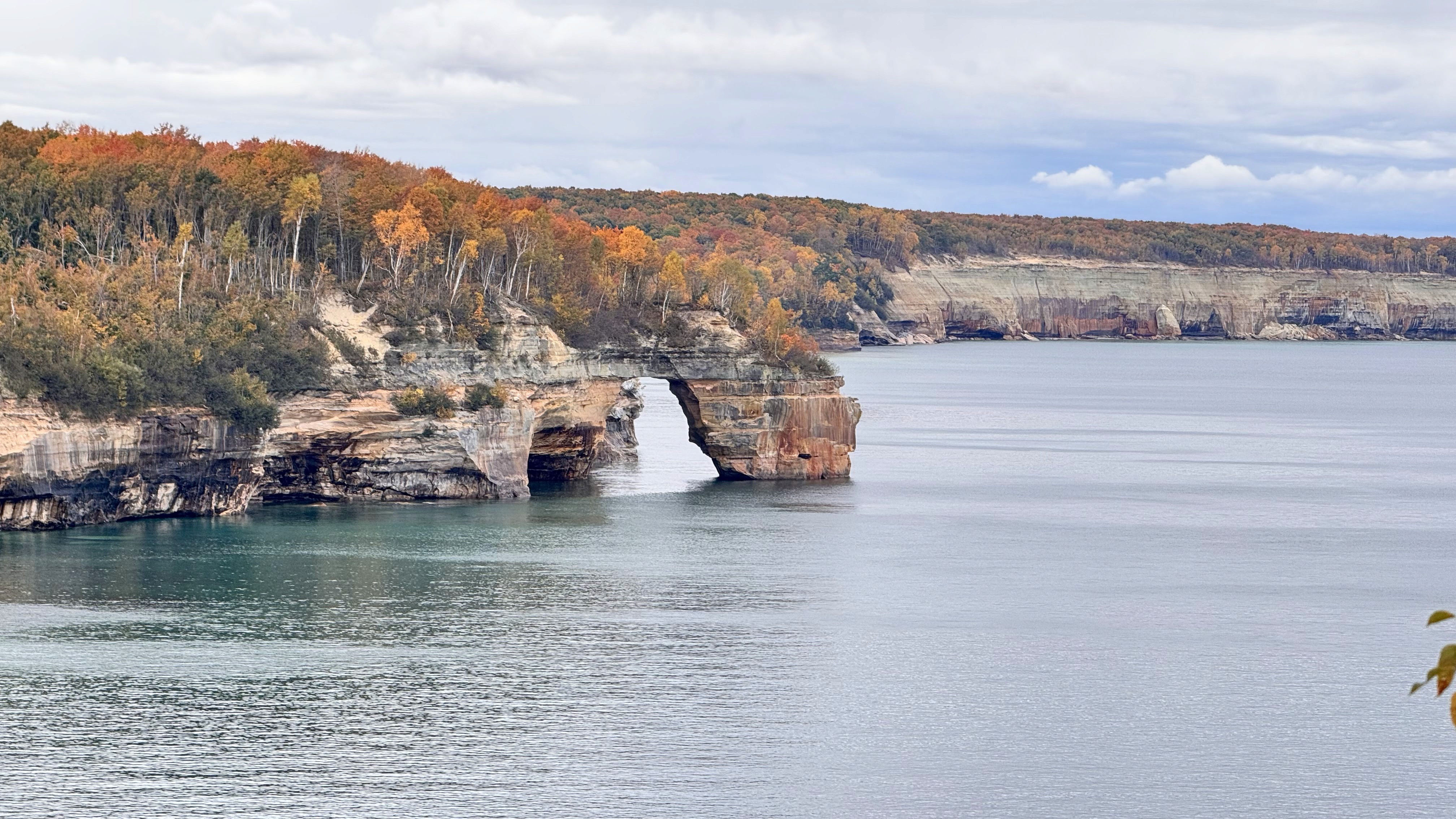 a group of people walking on a sidewalk