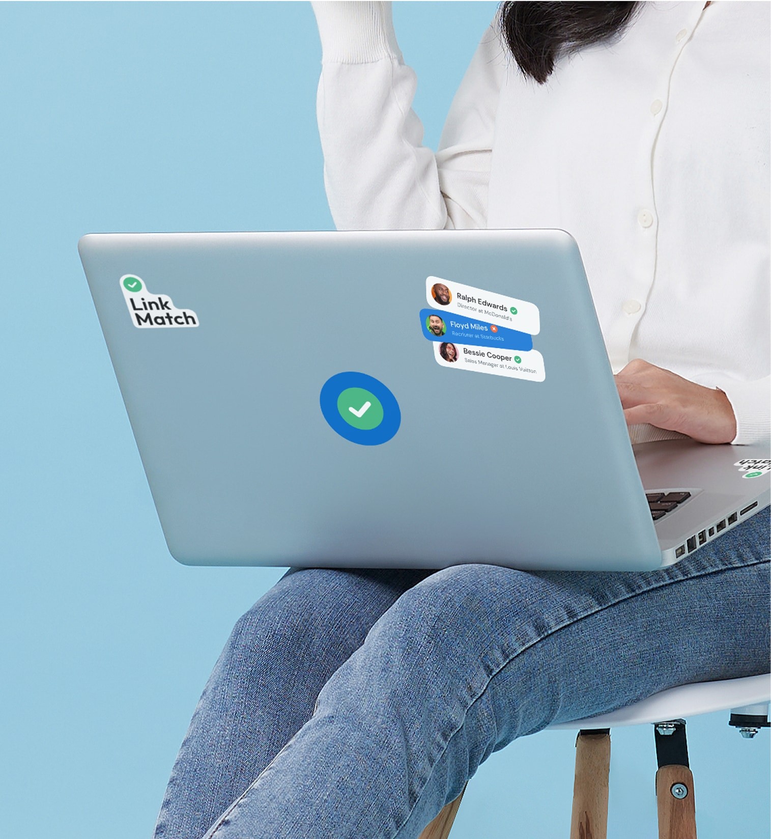 Laptop decorated with LinkMatch logo stickers and CRM contact preview labels