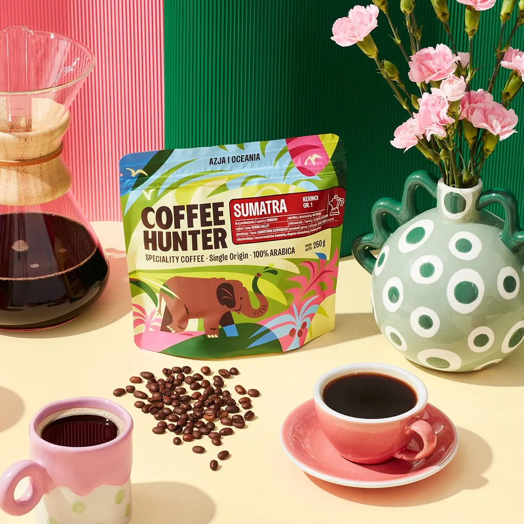 Coffee Hunter Sumatra coffee bag with an elephant illustration beside a Chemex and pink carnations, label design