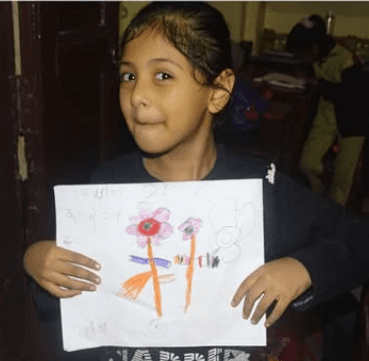 green chairs under umbrellas on shore
