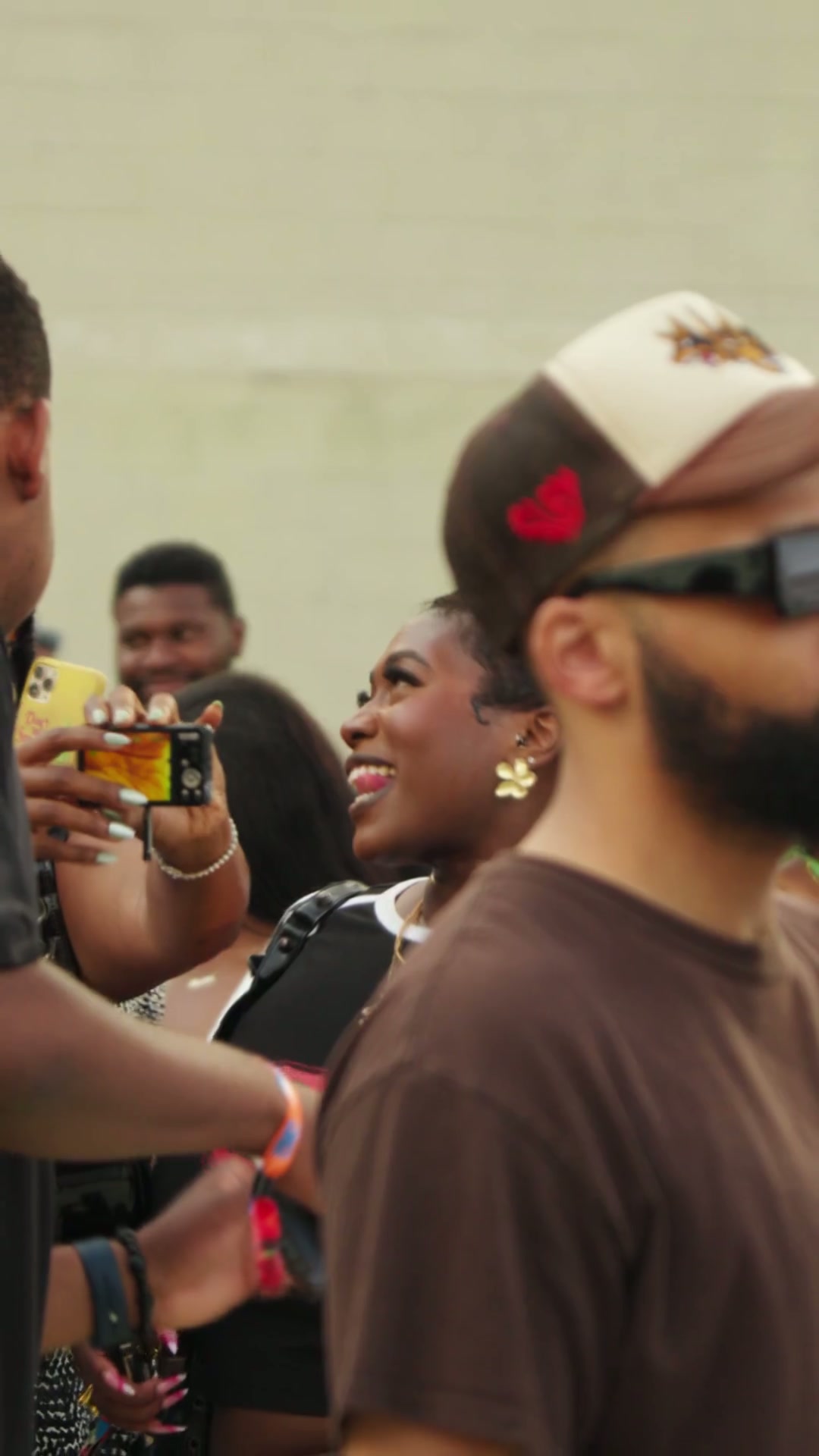 Person with light blue shirt looks to his right side