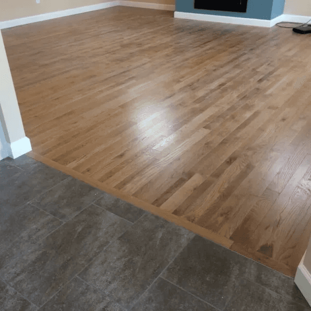 Beautiful hardwood flooring in a living room by Shilling's Carpets & Floors