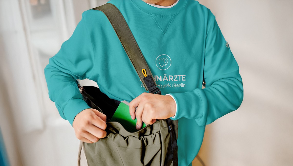 Family standing in a lush green field with tractor.