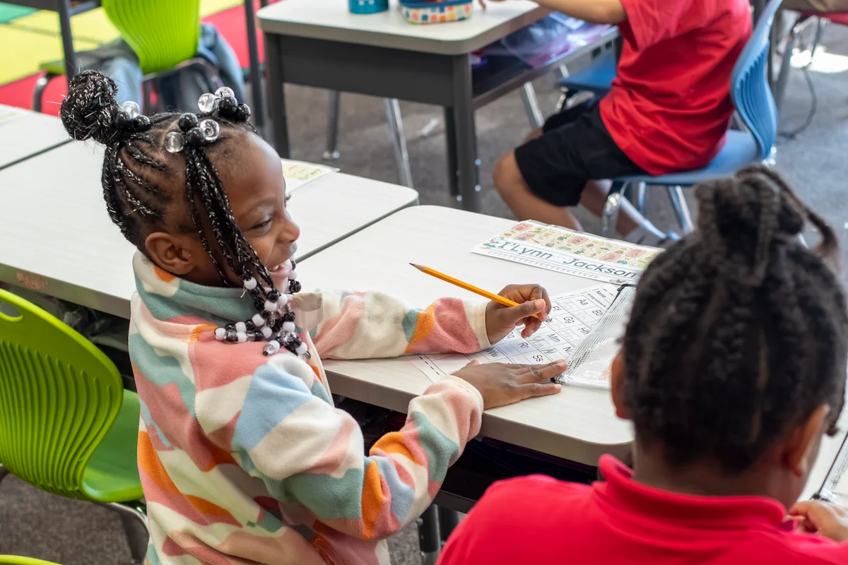 Elementary students at Buffalo Academy of Science sharing smiles during a social-emotional learning activity
