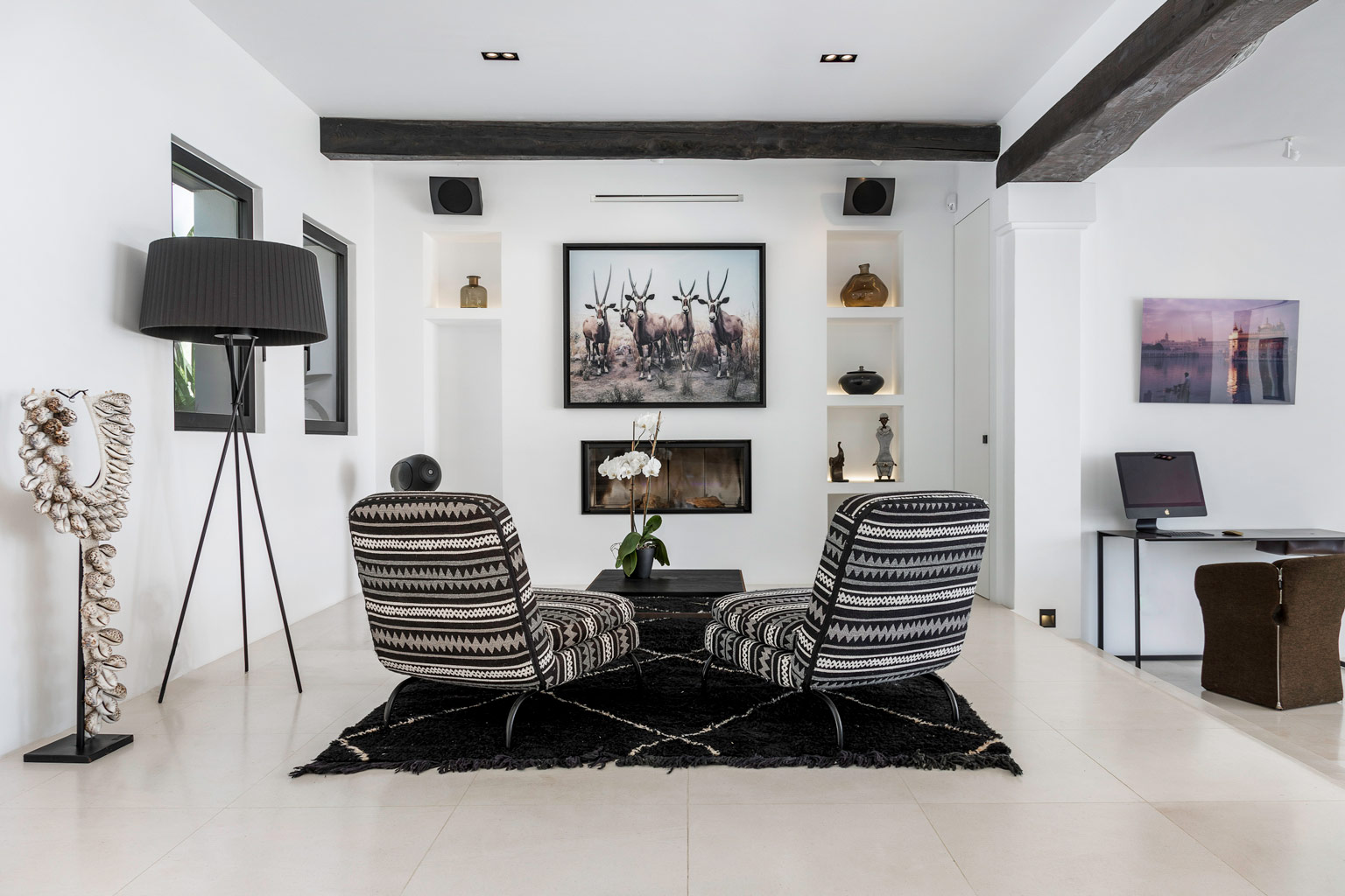 Fireplace and seating area inside an exclusive luxury villa Ibiza salon—private amenities, VIP estate property holiday retreat