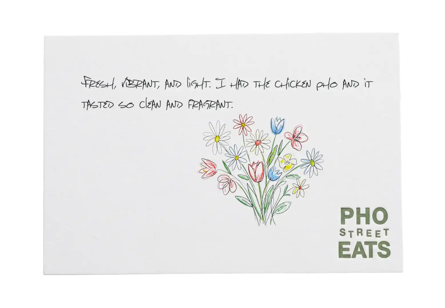 Pho Street Eats review card with a flower bouquet, praising the chicken pho.