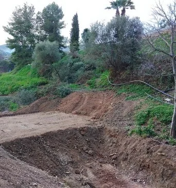 The dam excavation before filling