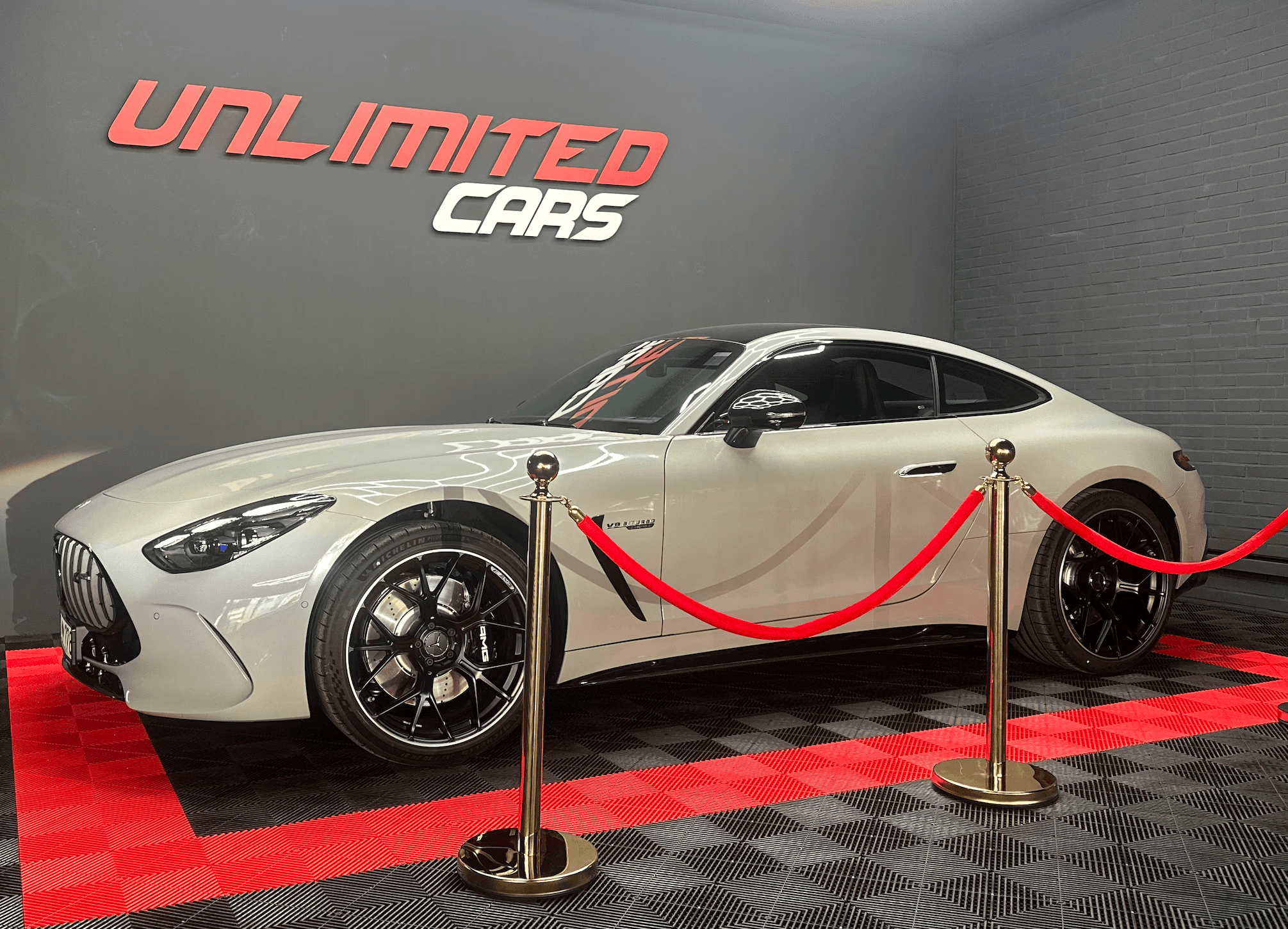 red bmw m 3 parked on parking lot during daytime