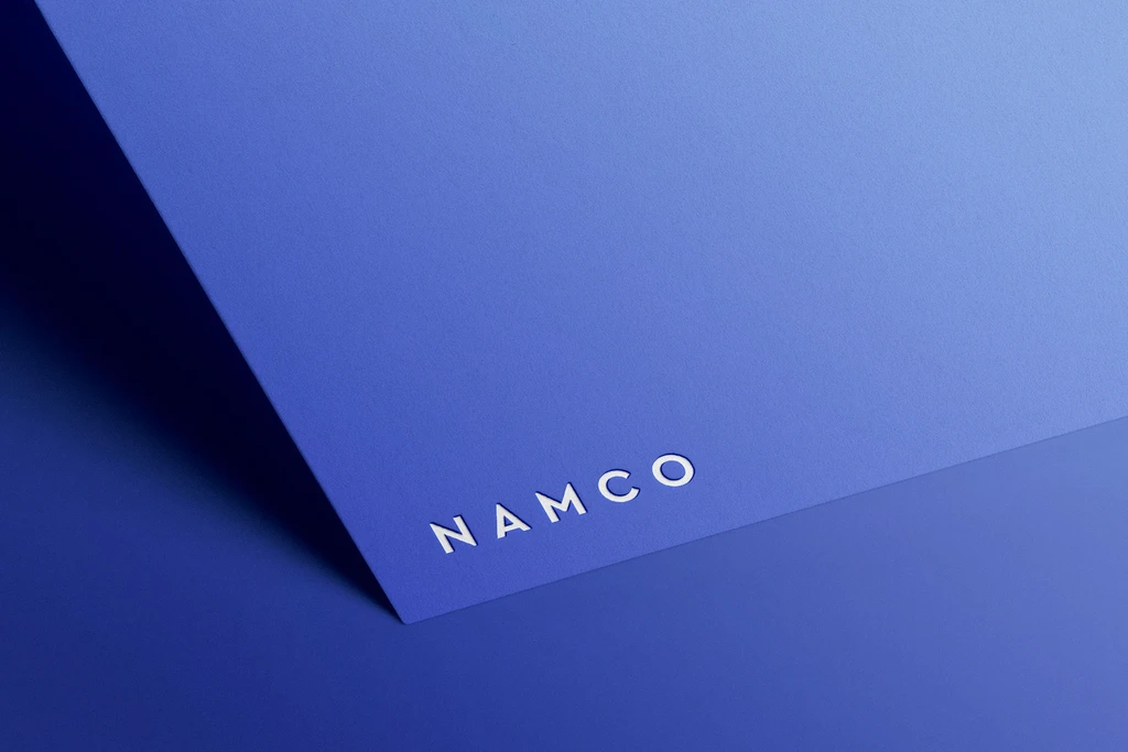 Elegant logo mockup on blue paper and blue background.