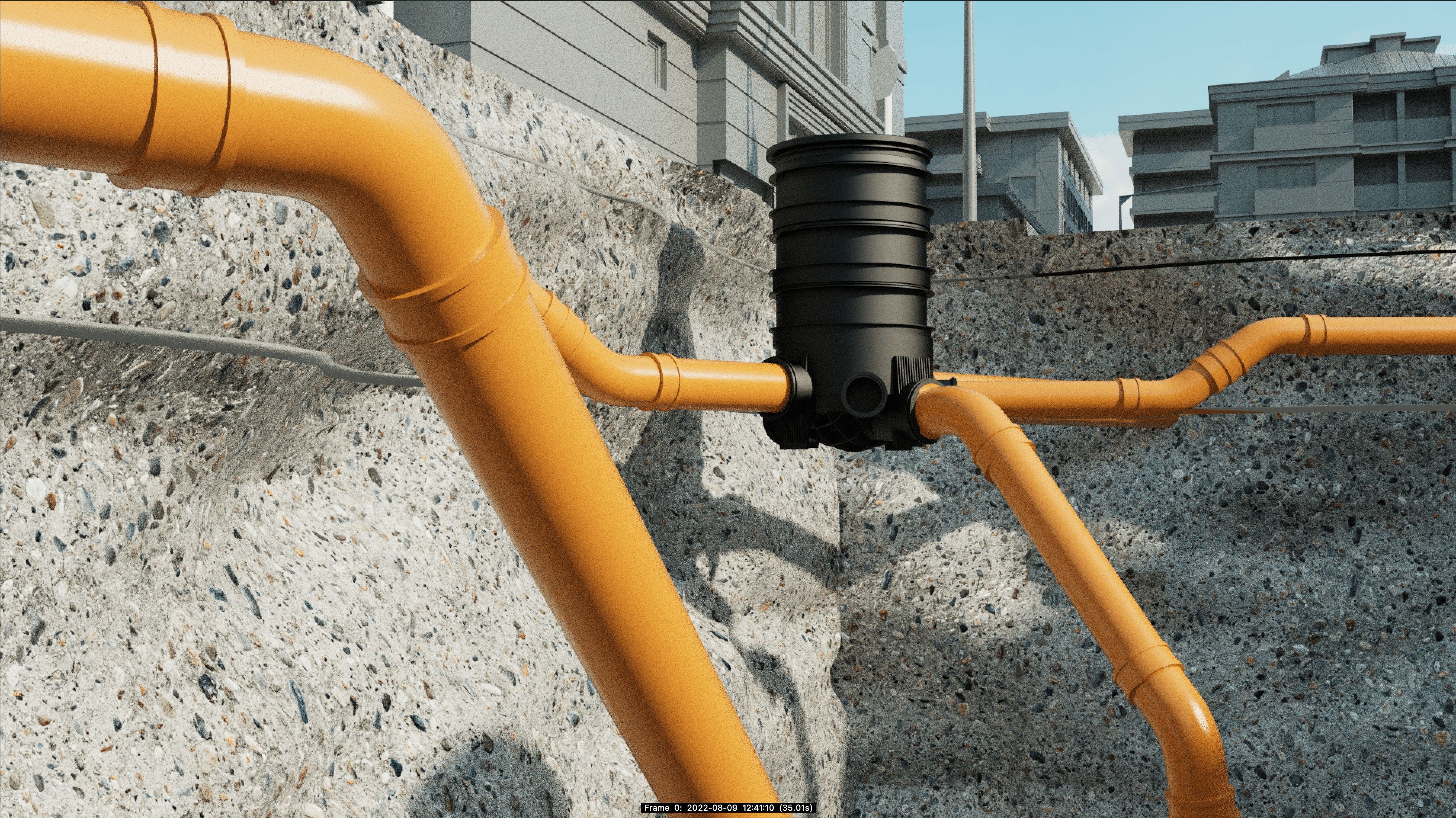 Underground view of orange drainage pipes connected to a central black junction box.