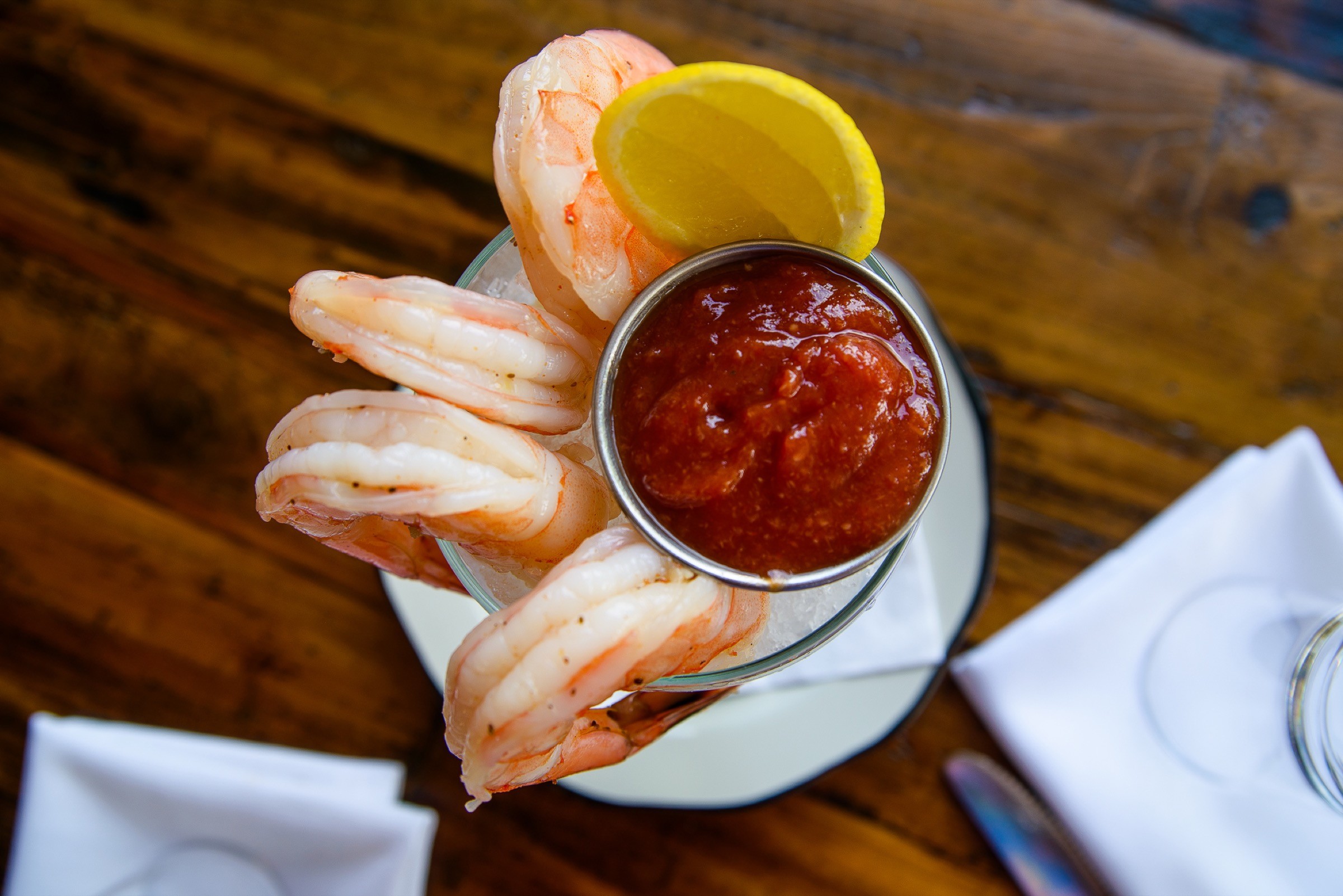 Overhead hospitality photograph of shrimp cocktail