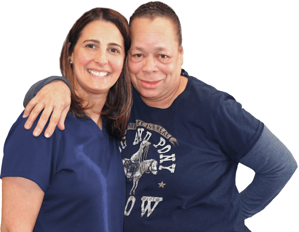 Patient with arms around Robin (physical therapist)