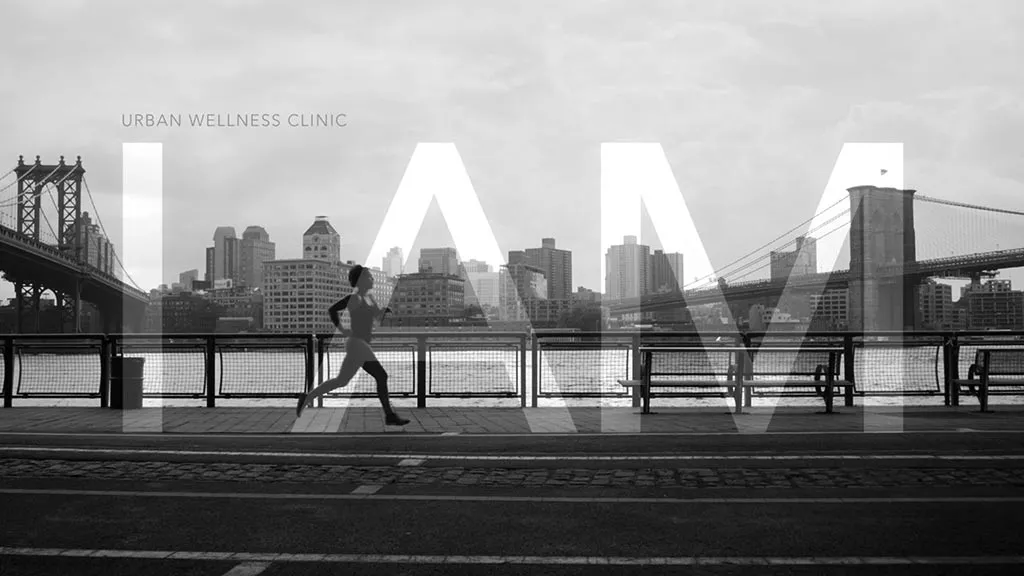 Woman running by Brooklyn Bridge