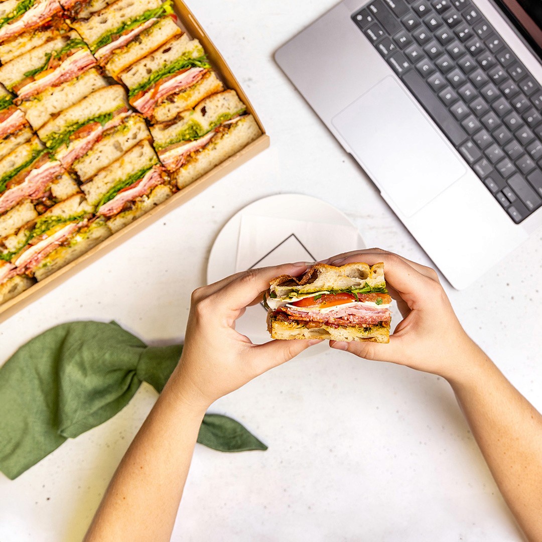 Italian Deli Sandwich being eaten at an office worker's desk