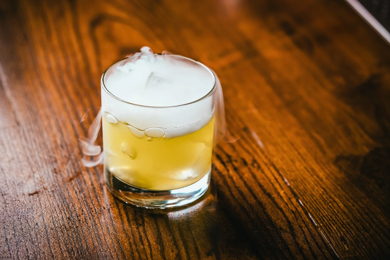 Fancy yellow smoking cocktail