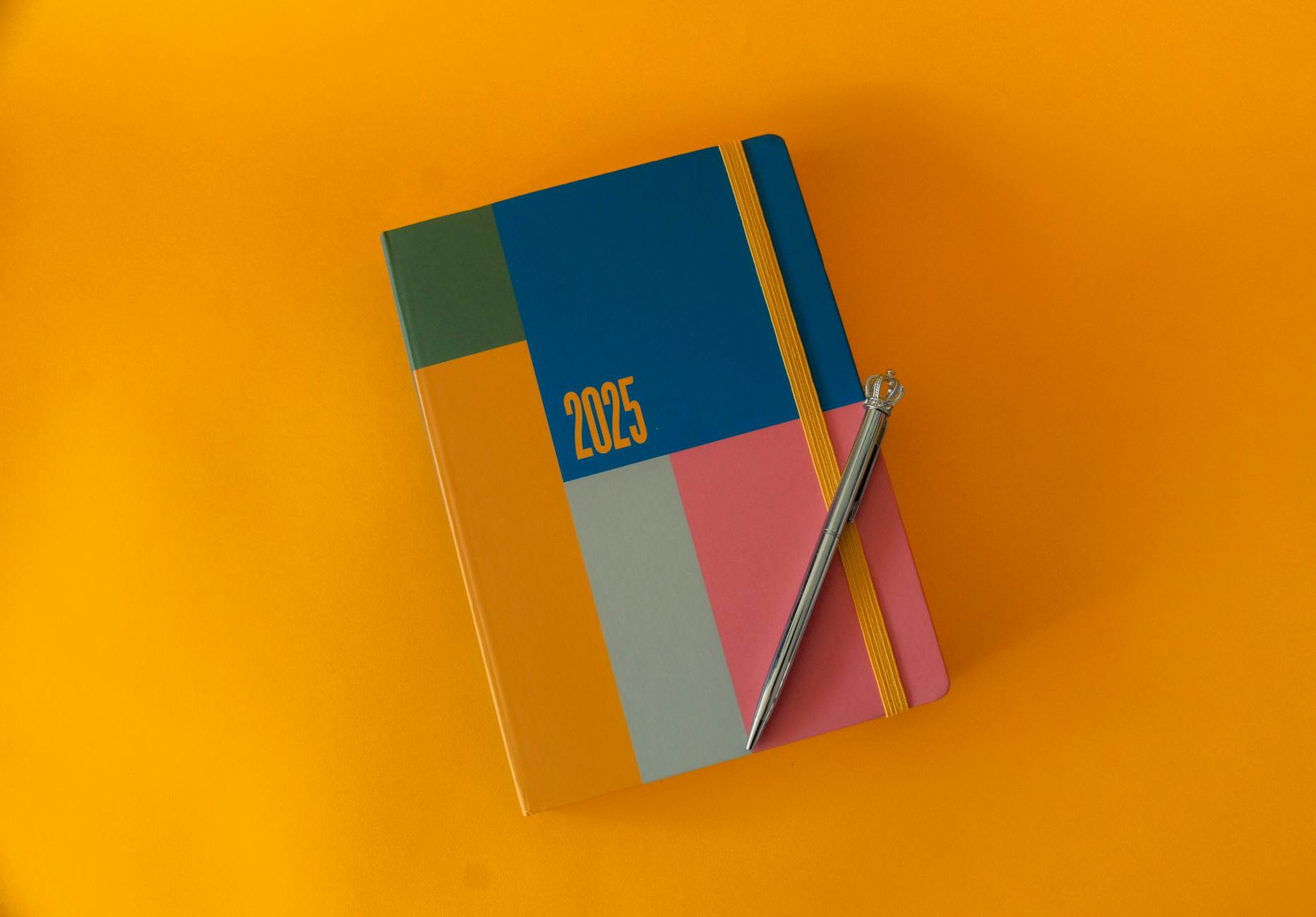 A clean laboratory desk featuring organized glass beakers, a microscope, and a fresh stack of science lessons.