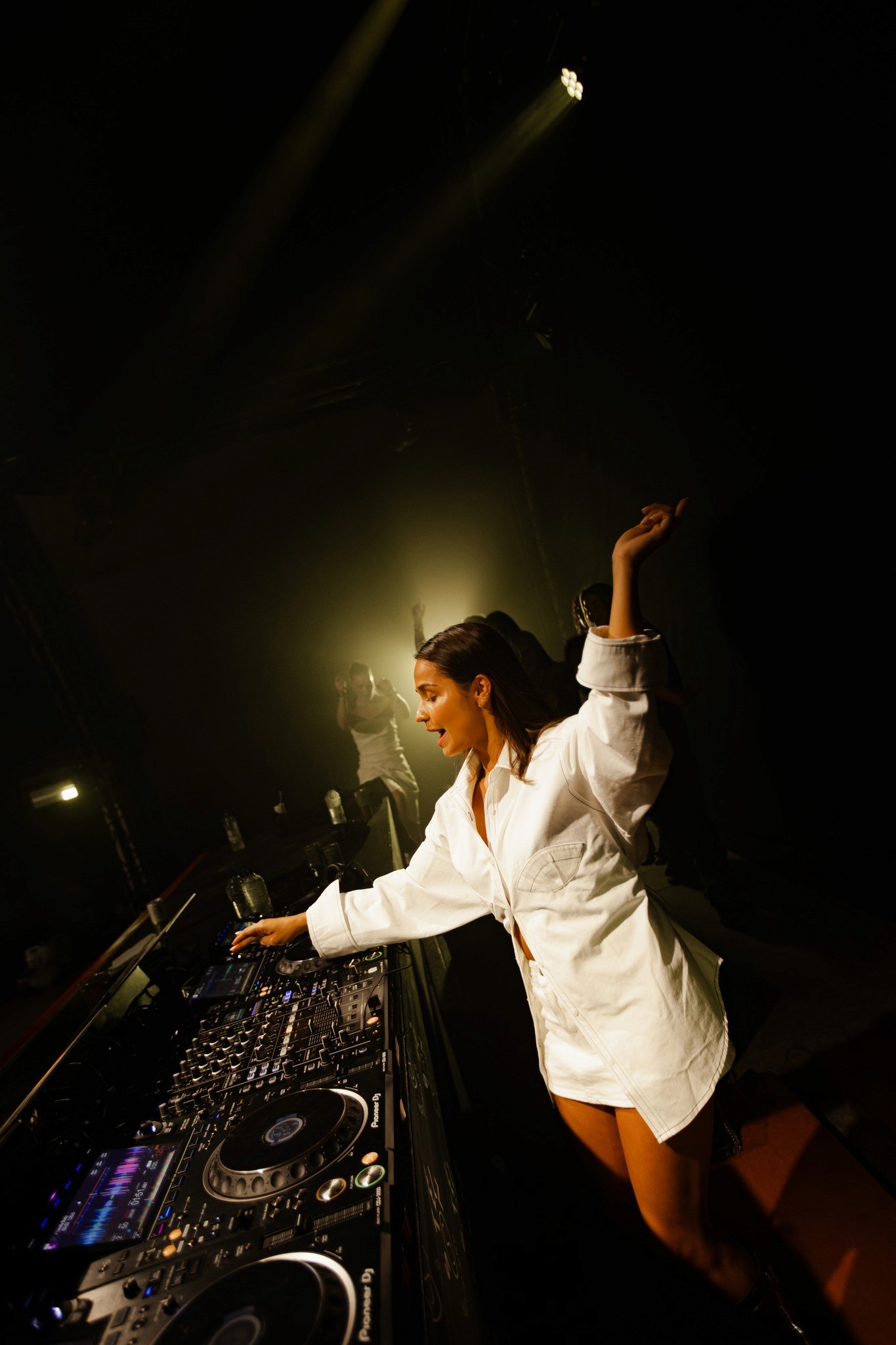 woman dancing on shoulders at music festival