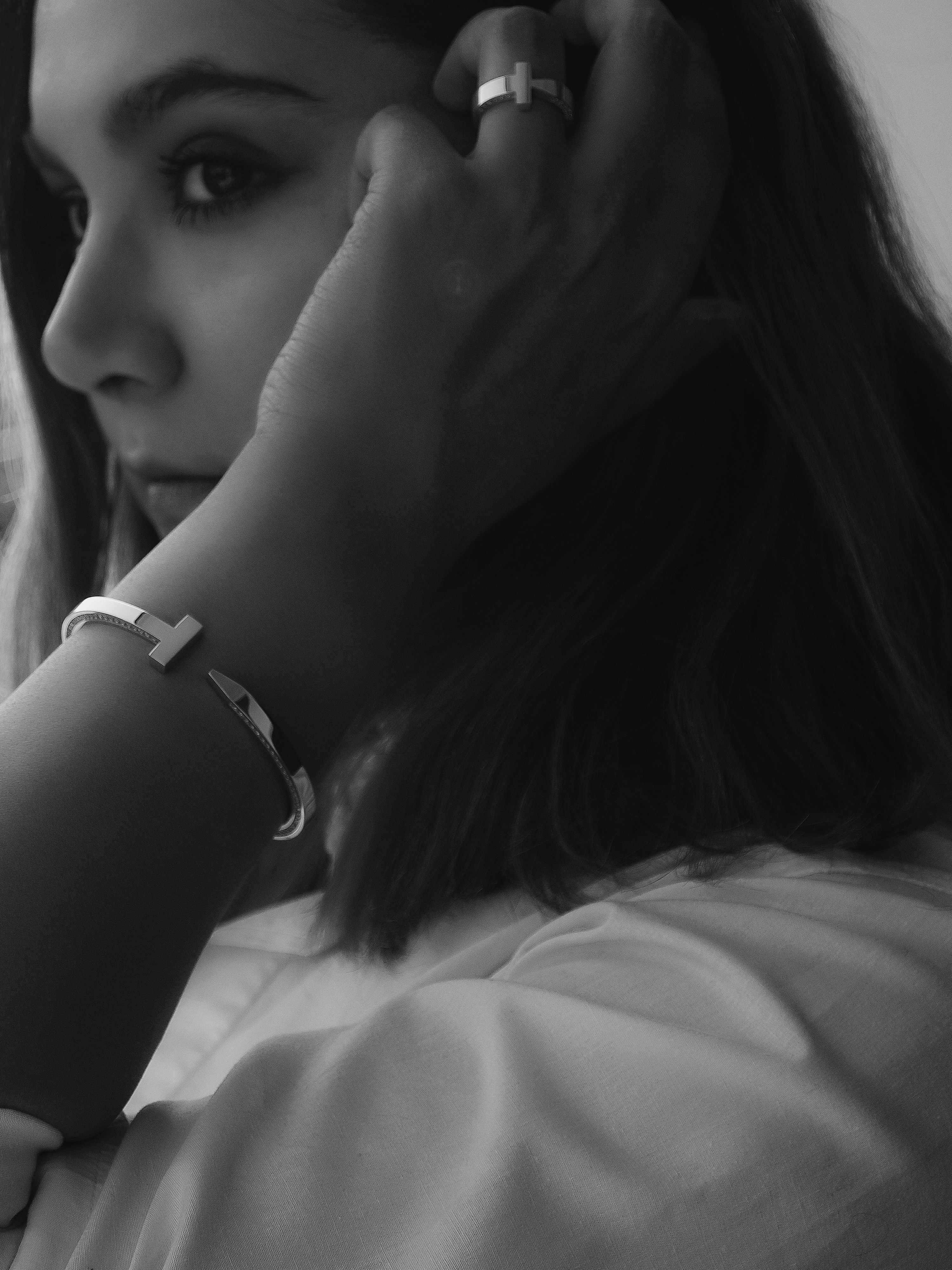 a woman with her hand on her face