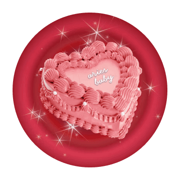 A decorative heart-shaped cake on a red circular plate, embellished with icing and sparkles.