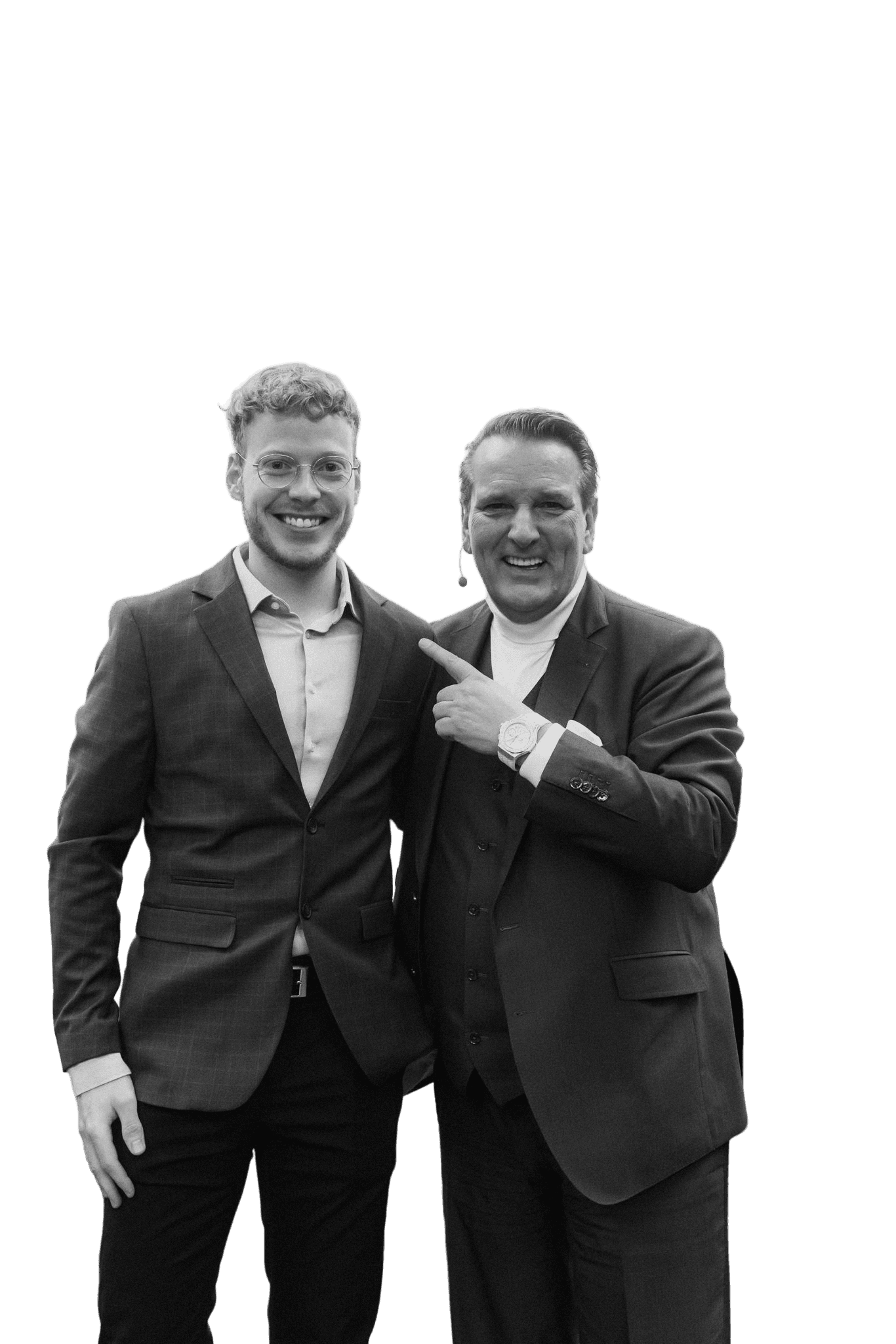 Close-up portrait of a person wearing a gray insulated hooded jacket with the hood up, showing their face framed by the hood against a light background.