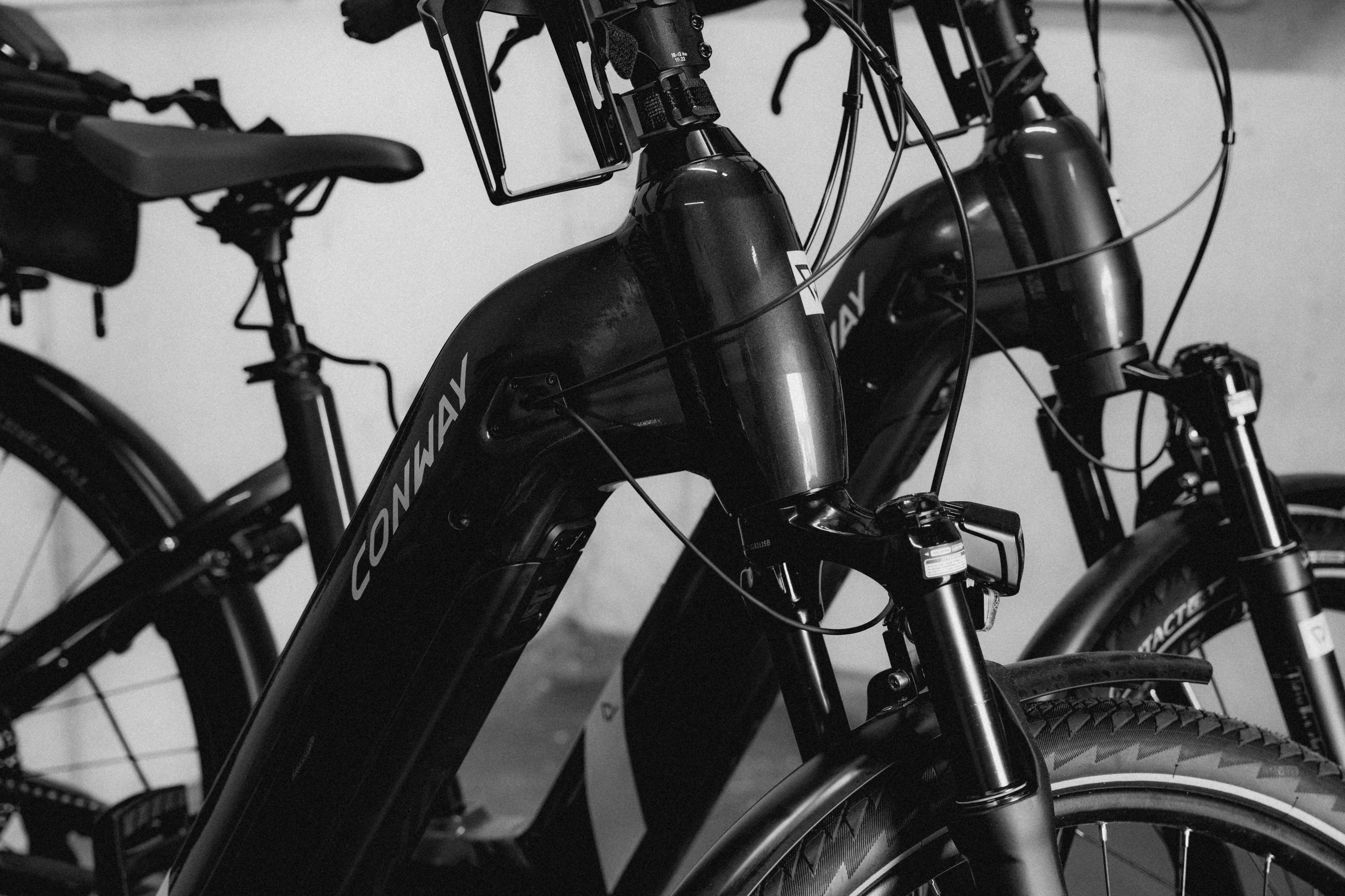 A modern bedroom featuring a large bed, a stylish chair, and decorative artwork on the wall.