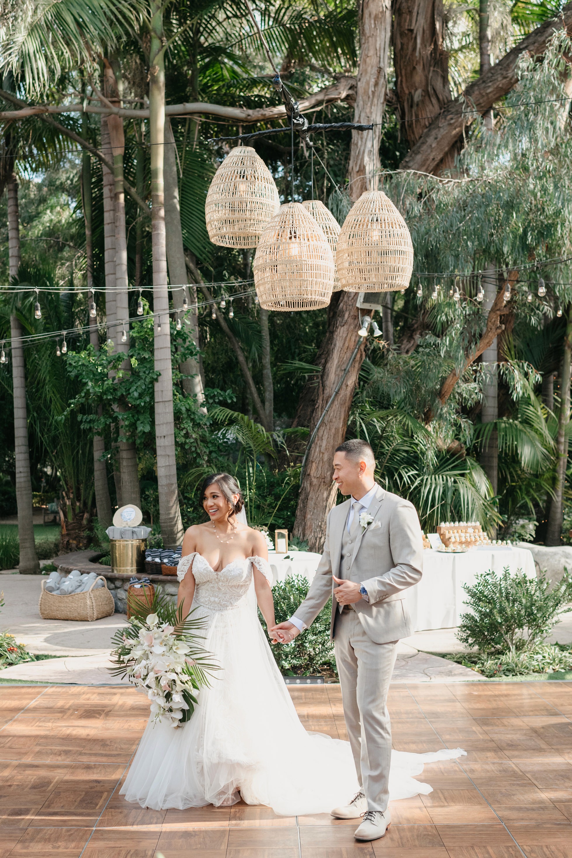 Flat lay wedding details with bouquet, rings, and sparkling bridal heels
