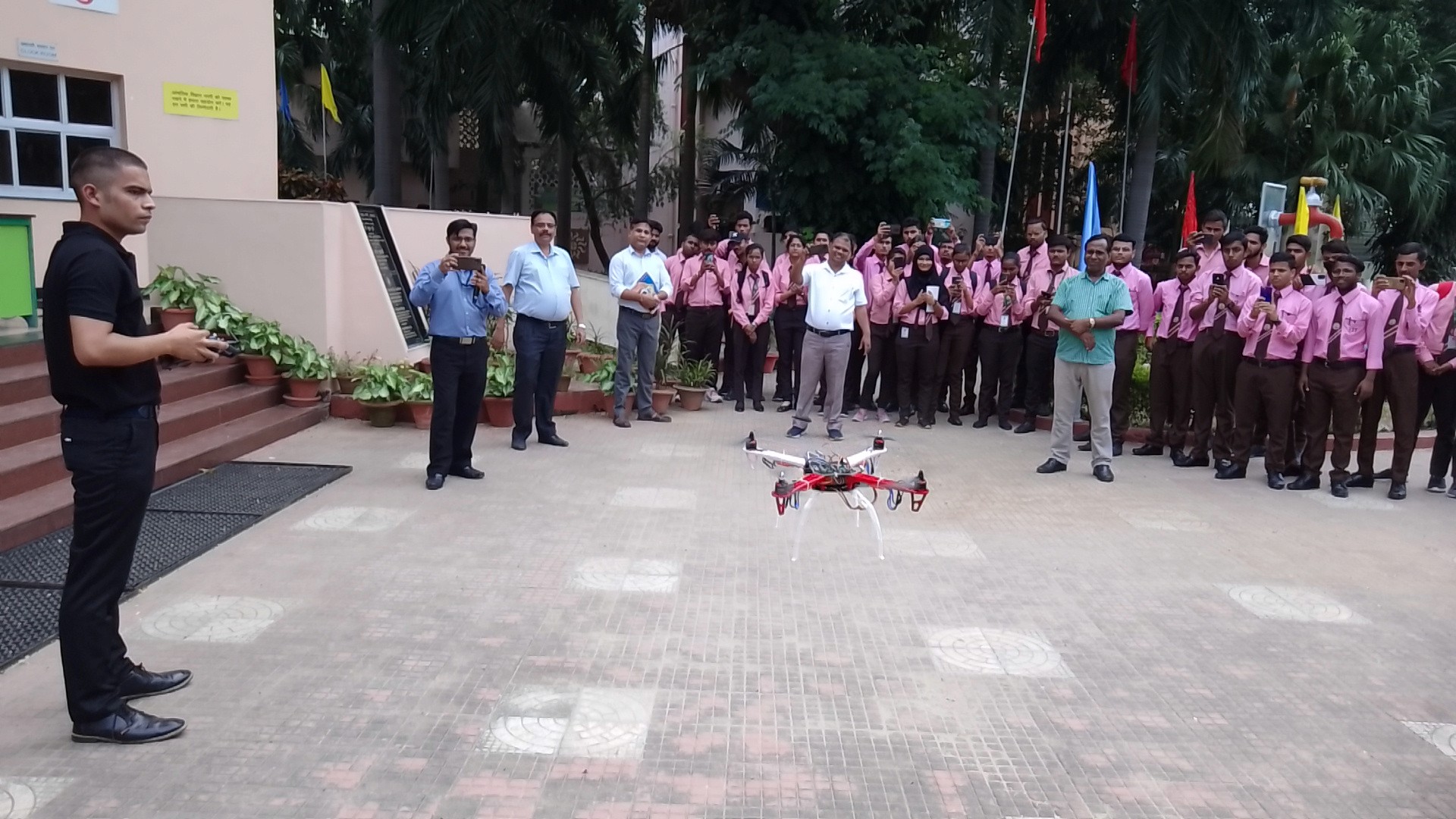 Full moon rising behind a house at night