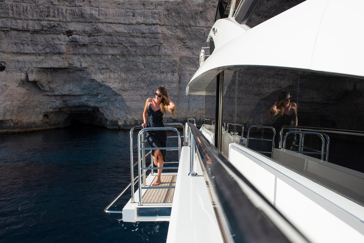 aerial photography of white yacht on calm waters