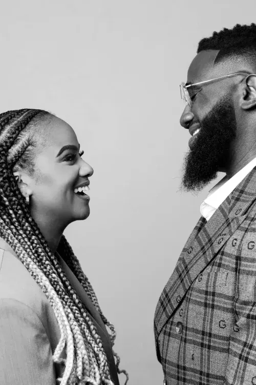 a man and a woman standing in a field
