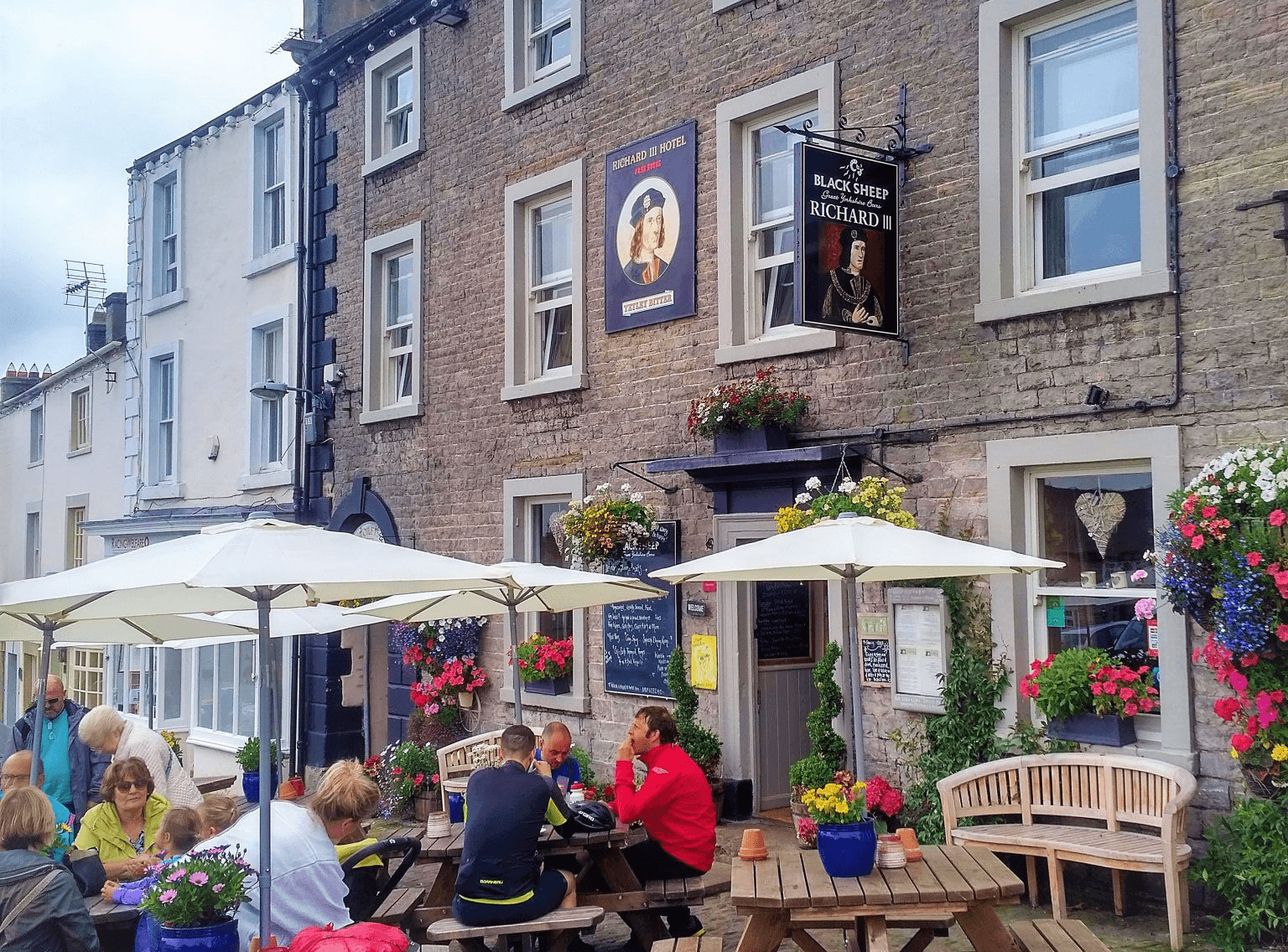 Richard III Hotel in Middleham with vibrant outdoor seating area, historic pub and restaurant in charming Yorkshire town setting