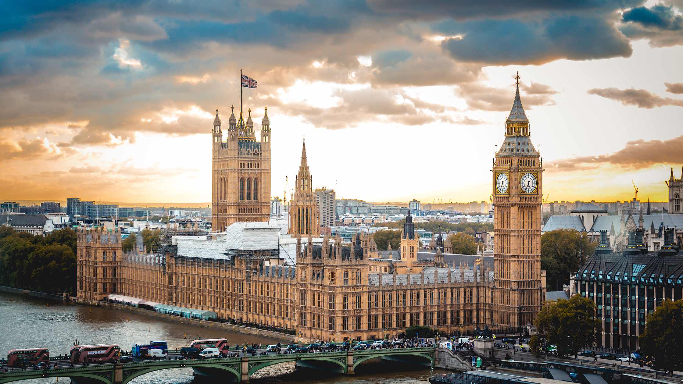 Aerial view of the Houses of Parliament and Big Ben beside the River Thames at sunset