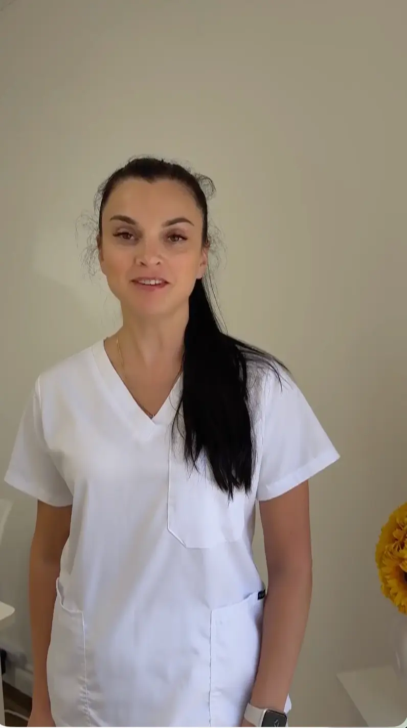 Beauty professional working in a premium coworking studio with professional lighting and equipment