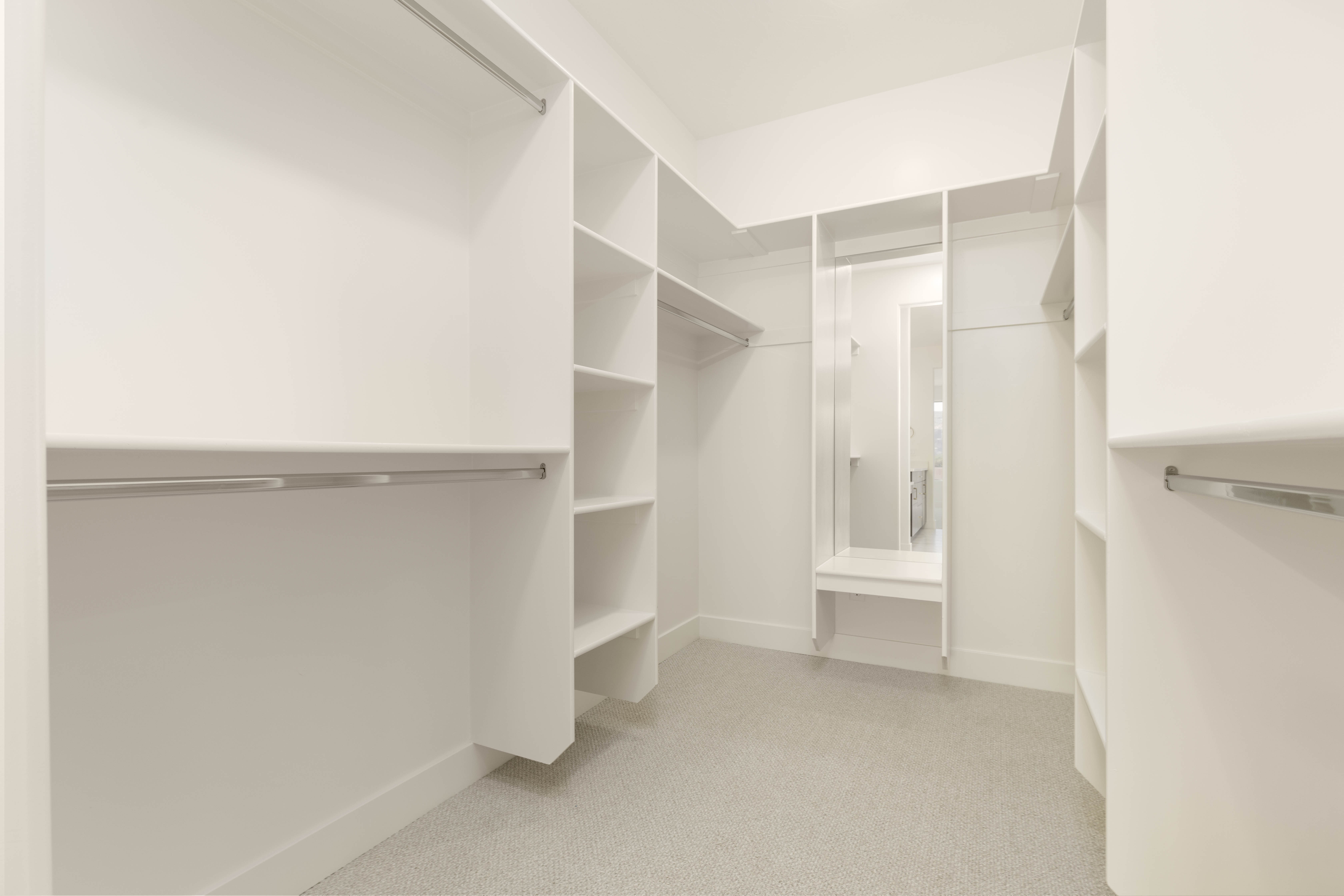 Spacious primary closet with built-in shelving in The Meridian new construction home in Hurricane Utah.