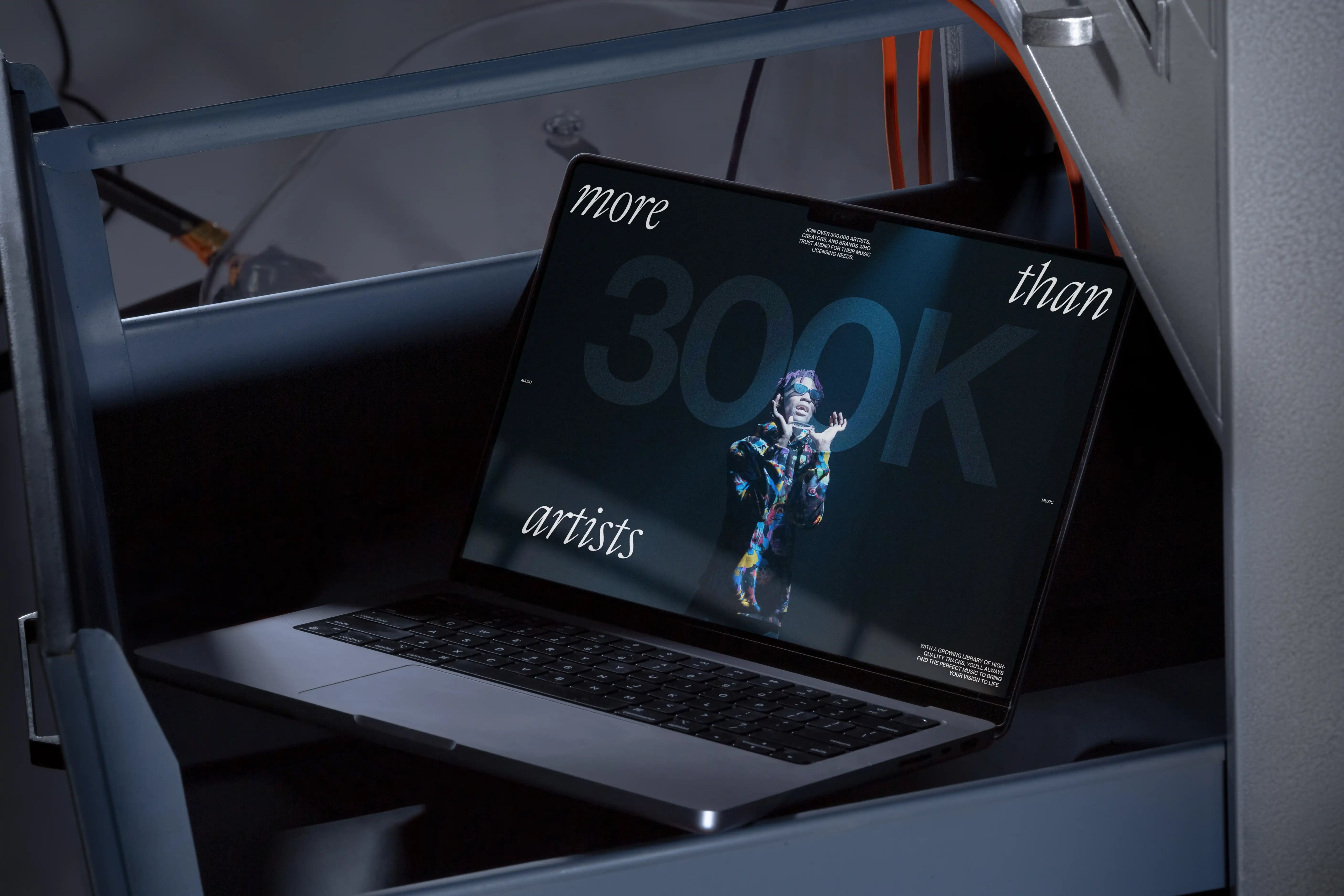 more than 300k artists web section laptop mockup