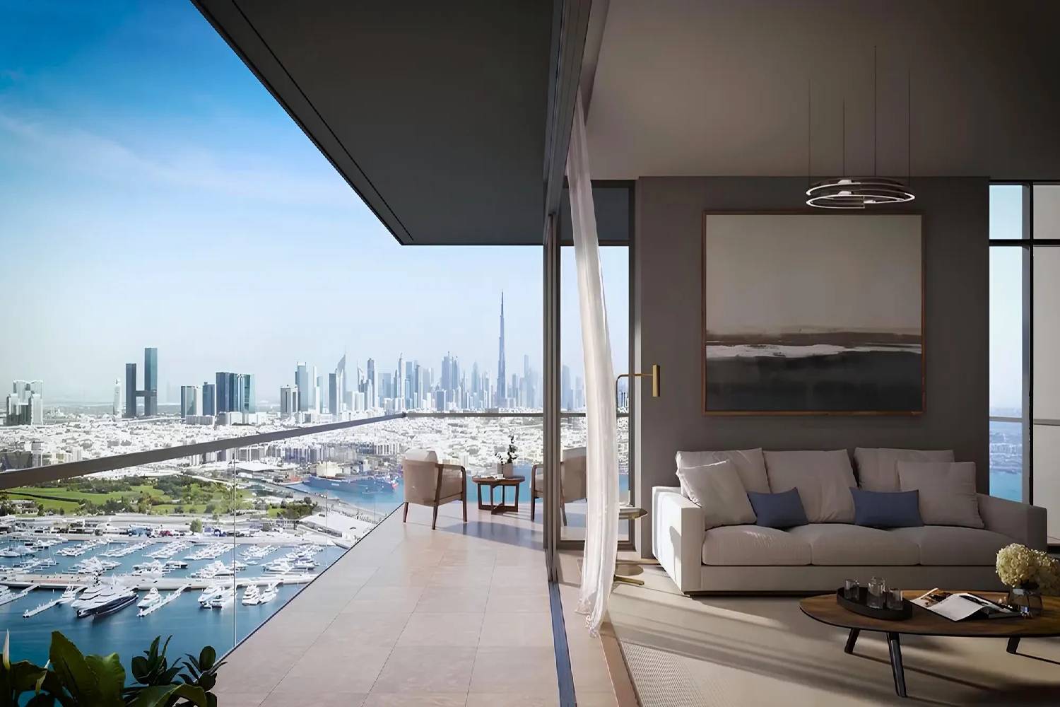 A modern living room featuring a stylish couch and a dining area, designed by ARIA by Beyond.