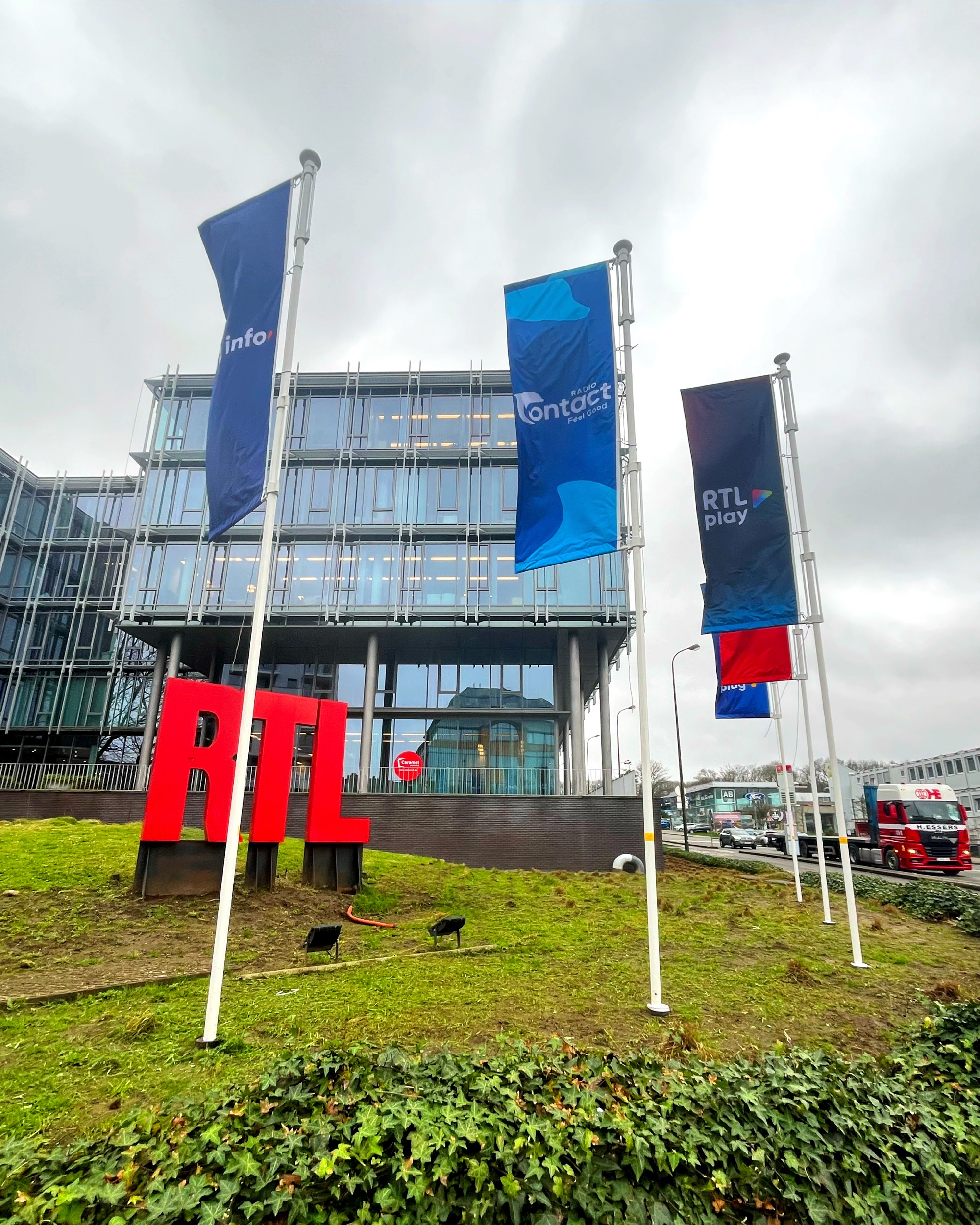 Metallic red-orange foil pouch with a reflective silver ODE logo printed at its centre, photographed on a pale peach background.