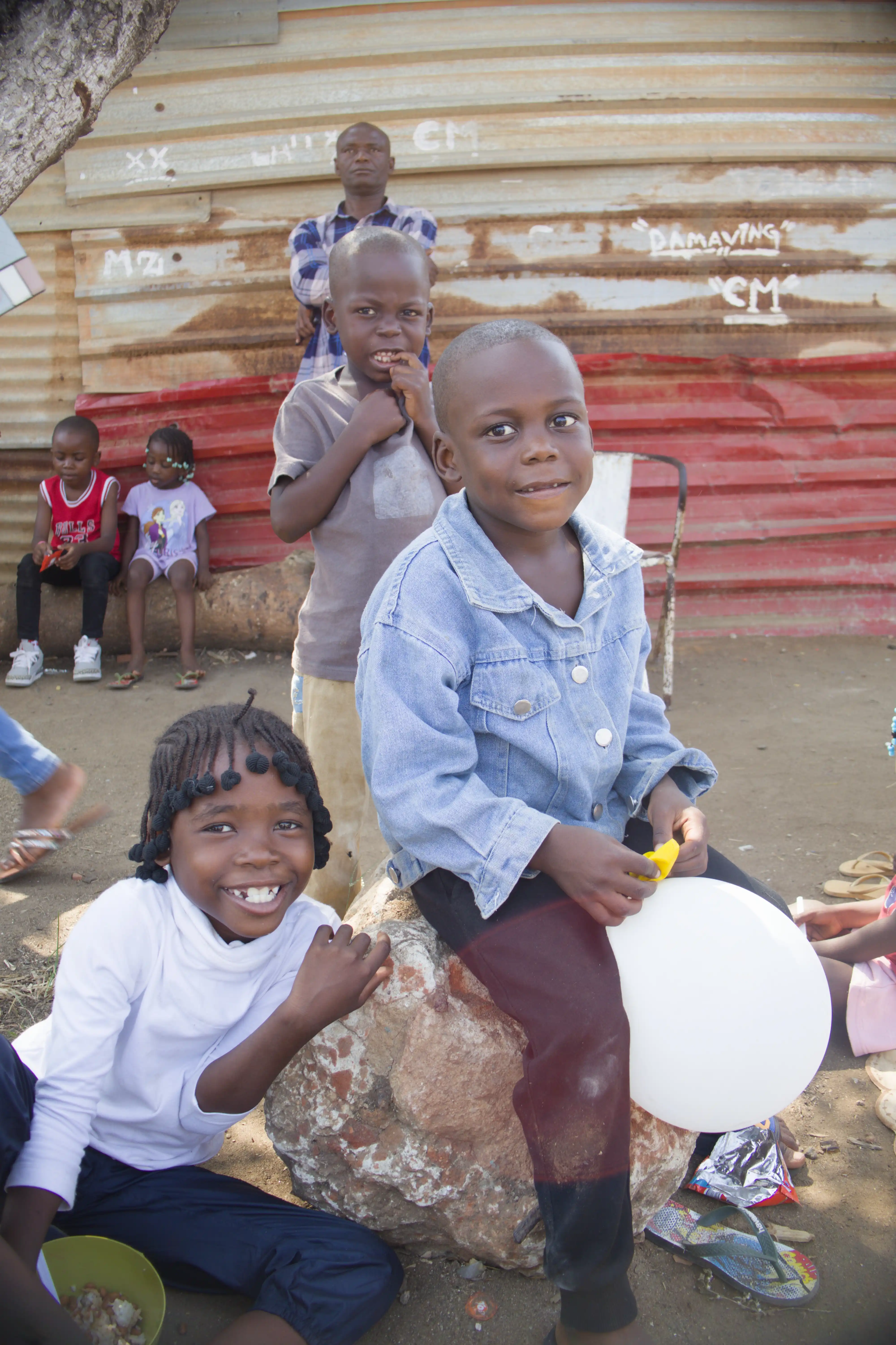 smiling children with balloon