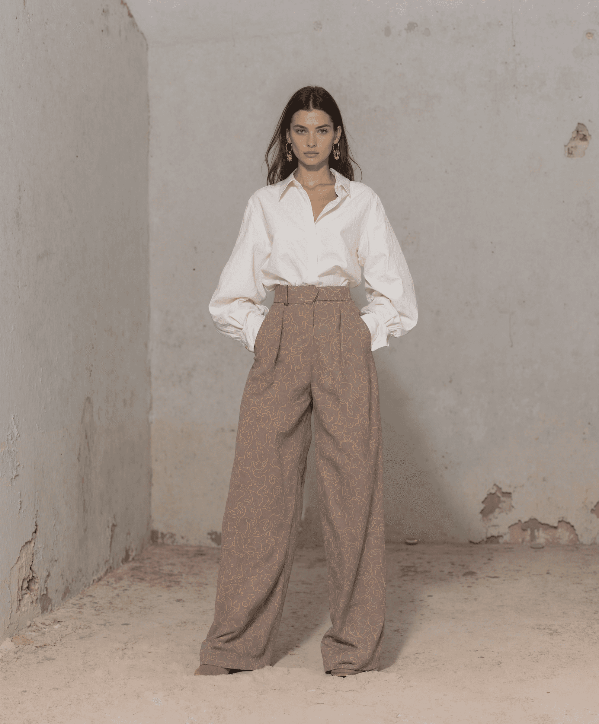 AI-generated lookbook image of a woman in a white blouse and brown high-waist trousers in a minimalist space, created by Myrovia Labs for La Fabrique. AI lookbook production for contemporary fashion brands.