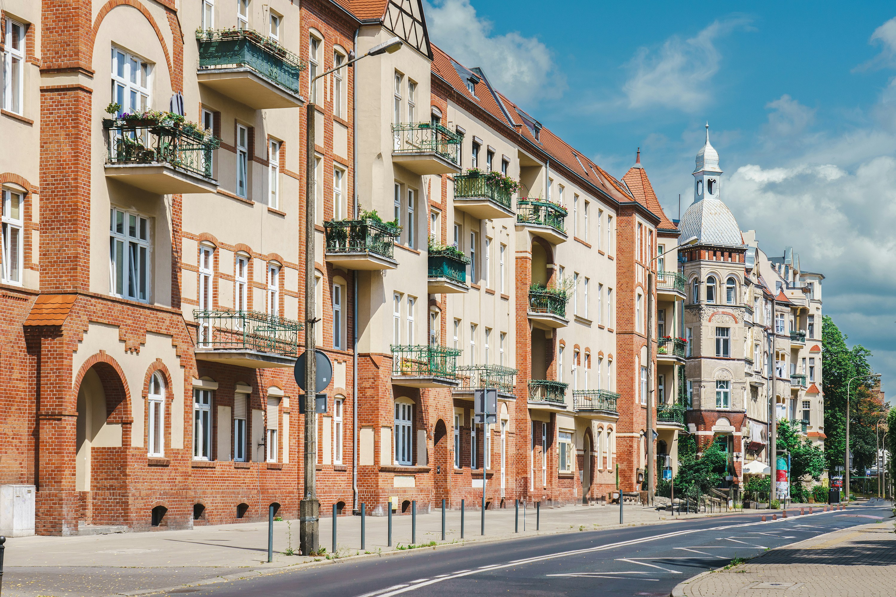 a row of brick buildings on a city street