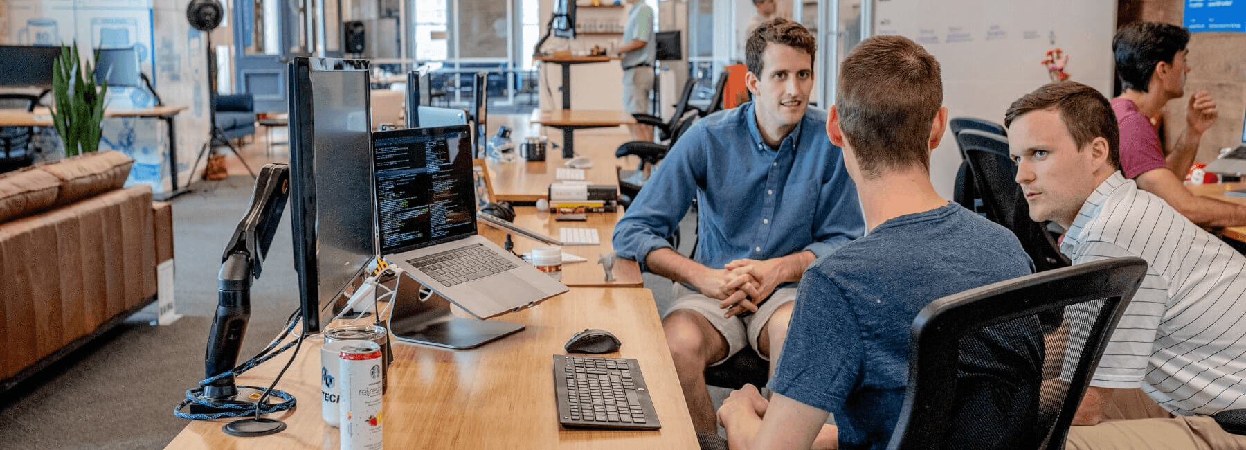 Colleagues discussing work - Product Adoption Analytics