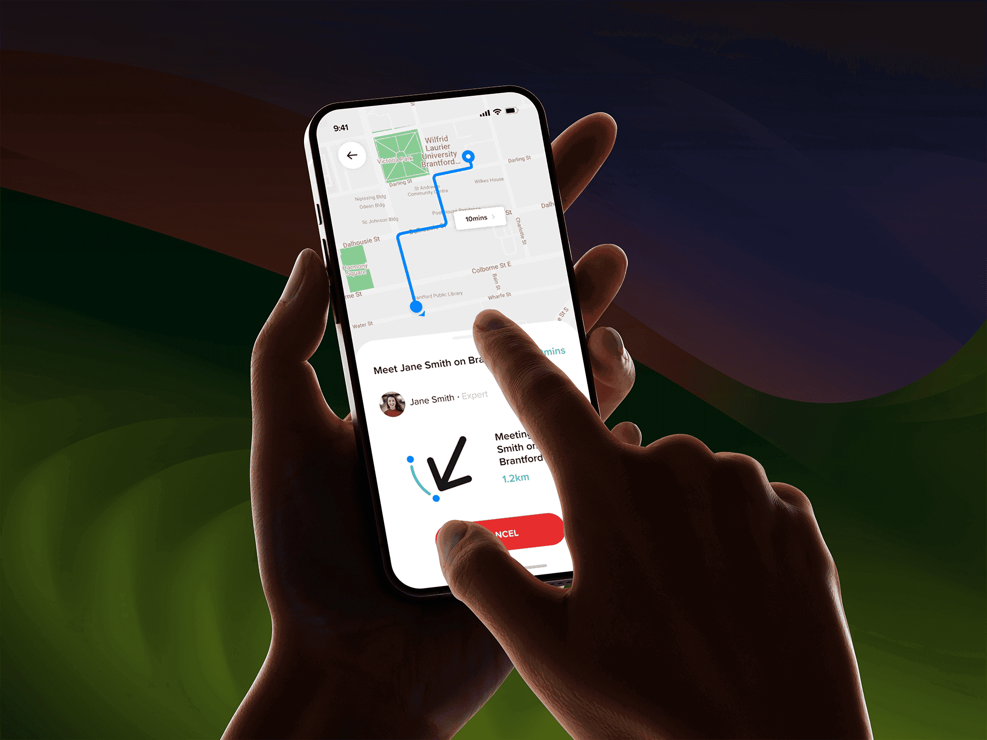 Close-up of a hand holding a smartphone displaying a navigation app with a route mapped out through Brantford, Ontario, showing a 10-minute travel time to a meeting point. The screen highlights a meeting with “Jane Smith” and a distance of 1.2 km, with a finger pointing at the cancel button on the app interface.