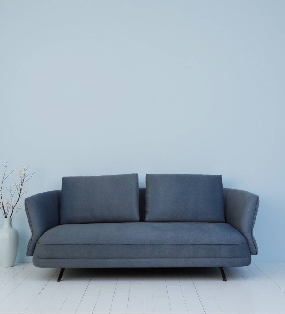 Luxury contemporary cane sofa with teal upholstery and wooden frame