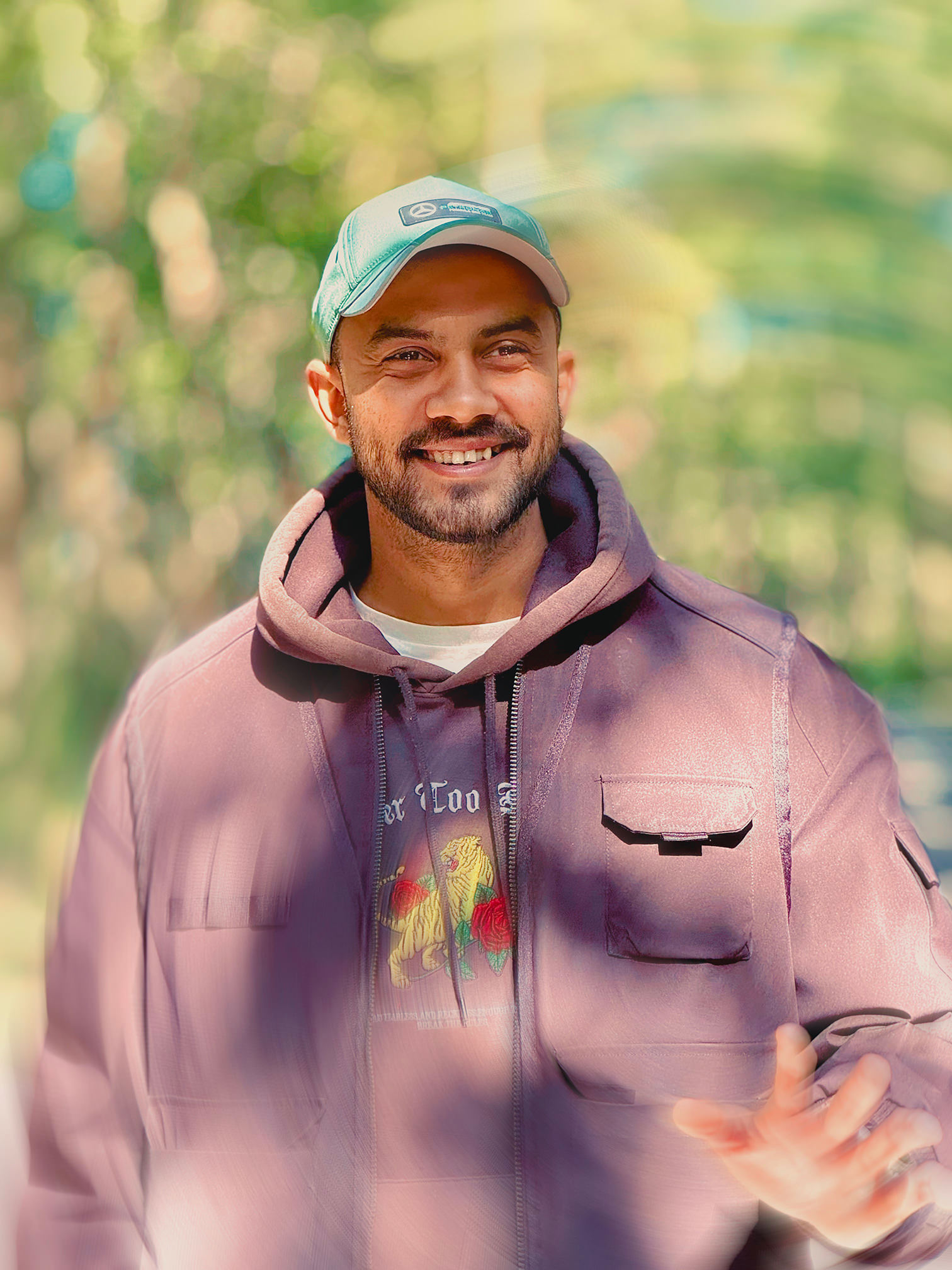 A smiling woman writing on a piece of paper in her home