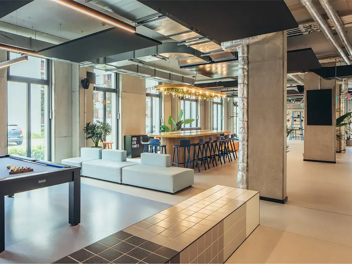 Social lounge in student accommodation in Göttingen with pool table, bar seating and shared relaxation space